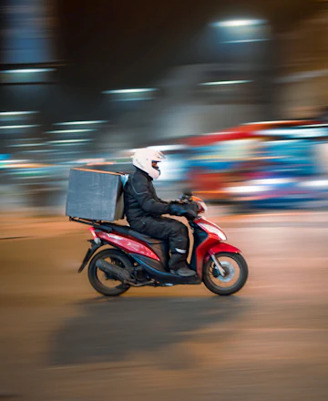 Danilo, a delivery rider at night