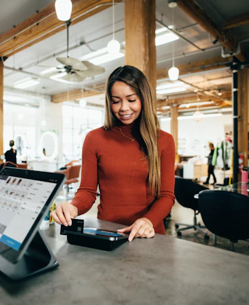 Mei, a shopkeeper at her till
