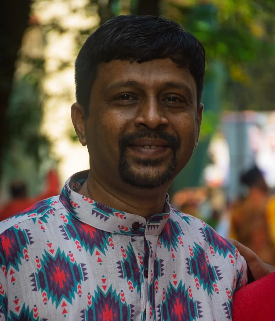 Arun, smiling after a long shift in Dubai