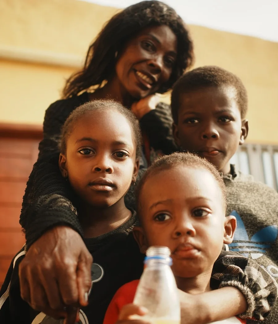 His mother and the children together at home in Freetown