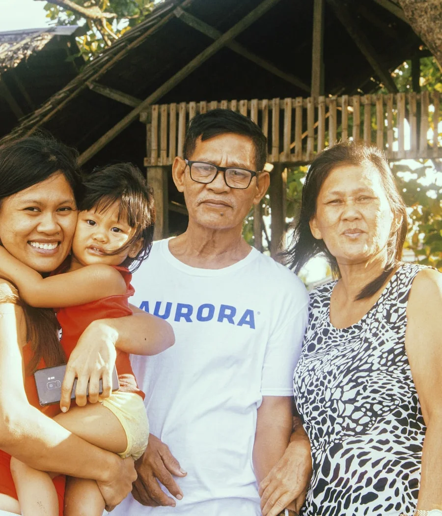 His family together outside their home in Manila