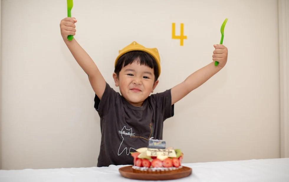 A boy back home celebrating the birthday surprise you sent