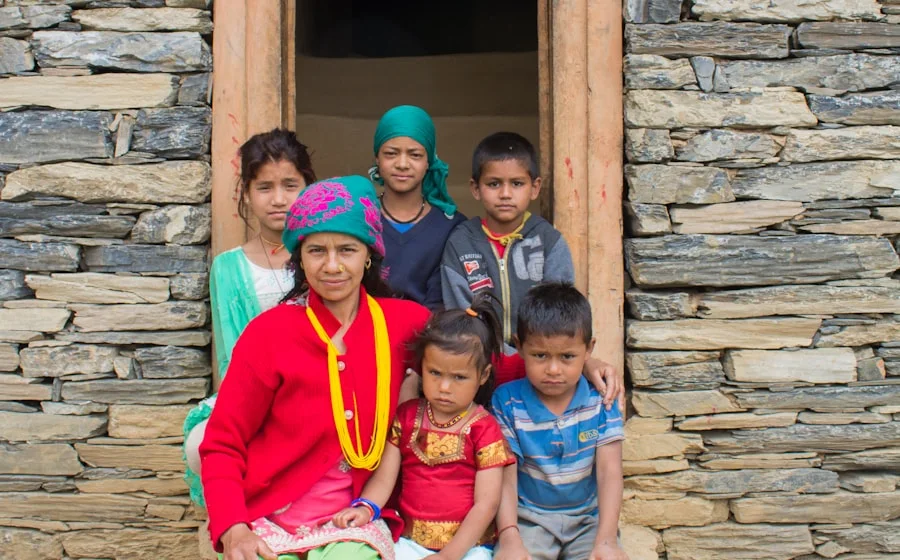 His family outside their home in the Kathmandu valley