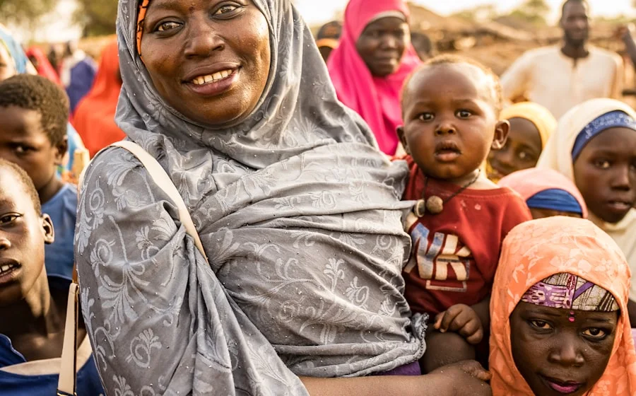 His mother and the neighbourhood kids in Khartoum