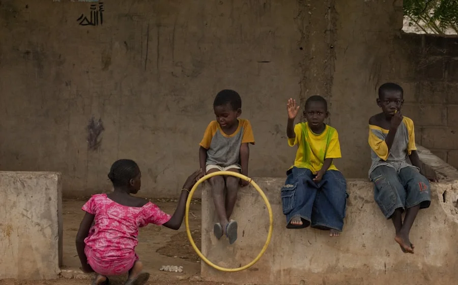 His kids playing outside in Dakar