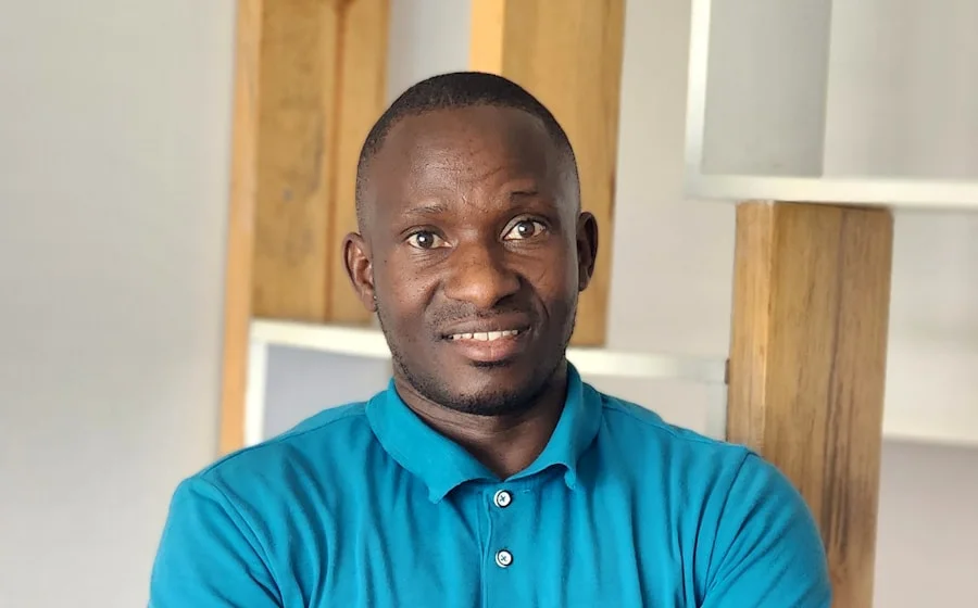 A Ugandan concierge in Dubai smiling